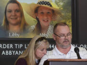 FILE - Grandparents of victim Libby German, Becky Patty, left, and her husband Mike Patty, speak during a news conference for the latest updates on the investigation of the double homicide of Liberty German and Abigail Williams on Thursday, March 9, 2017, at Carroll County Courthouse in Delphi, Ind. (J.