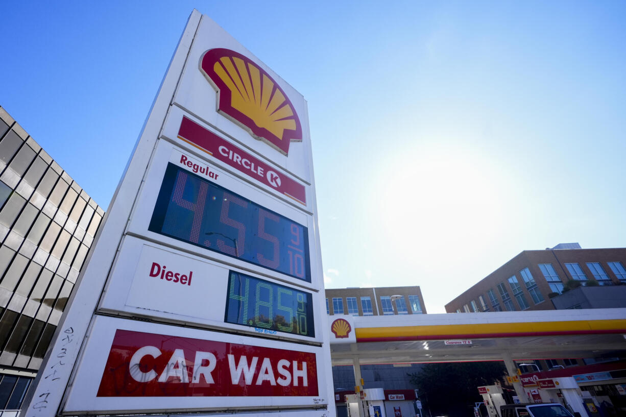 Prices are displayed on a corner sign at a Shell gas station, Wednesday, Oct. 9, 2024, in Seattle.