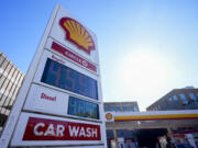 Prices are displayed on a corner sign at a Shell gas station, Wednesday, Oct. 9, 2024, in Seattle.