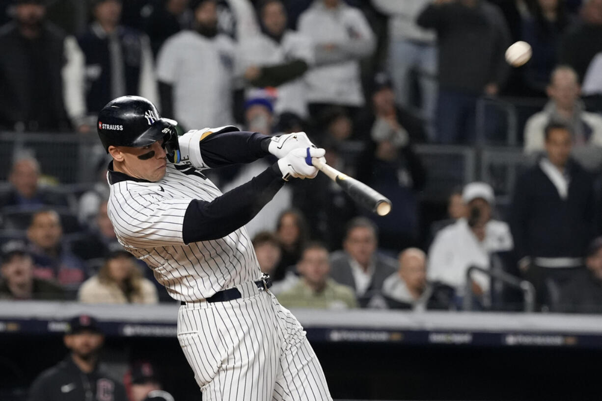 New York Yankees' Aaron Judge hits a two-run home run against the Cleveland Guardians during the seventh inning in Game 2 of the baseball AL Championship Series Tuesday, Oct. 15, 2024, in New York.