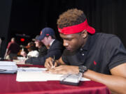 The time-honored tradition of high school athletes proudly sitting behind a table and signing a national letter of intent is a thing of the past. In its place starting next month, athletes will ink their name to financial aid packages that will likely be tied to a revenue-sharing contract.