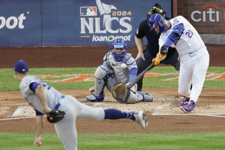 New York Mets' Pete Alonso hits a three-run home run against the Los Angeles Dodgers during the first inning in Game 5 of a baseball NL Championship Series, Friday, Oct. 18, 2024, in New York.