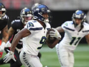 Seattle Seahawks running back Kenneth Walker III (9) had 14 carries for 69 yards and a touchdown against the Atlanta Falcons, on Sunday, Oct. 20, 2024, at Atlanta.