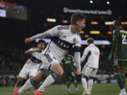 Vancouver Whitecaps midfielder Ryan Gauld scores a goal during the first half of an MLS soccer match against the Portland Timbers Wednesday, Oct. 23, 2024, in Portland, Ore.