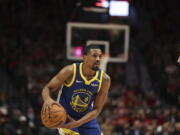 Golden State Warriors guard De'Anthony Melton (8) plays during an NBA basketball game against the Portland Trail Blazers Wednesday, Oct. 23, 2024, in Portland, Ore. The Golden State Warriors won 139-104.