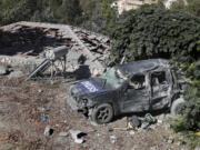 A destroyed journalists' car at the site where an Israeli airstrike hit a compound housing journalists, killing three media staffers from two different news agencies according to Lebanon's state-run National News Agency, in Hasbaya village, southeast Lebanon, Friday, Oct. 25, 2024.