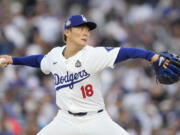 Los Angeles Dodgers pitcher Yoshinobu Yamamoto throws against the New York Yankees during the first inning in Game 2 of the baseball World Series, Saturday, Oct. 26, 2024, in Los Angeles.