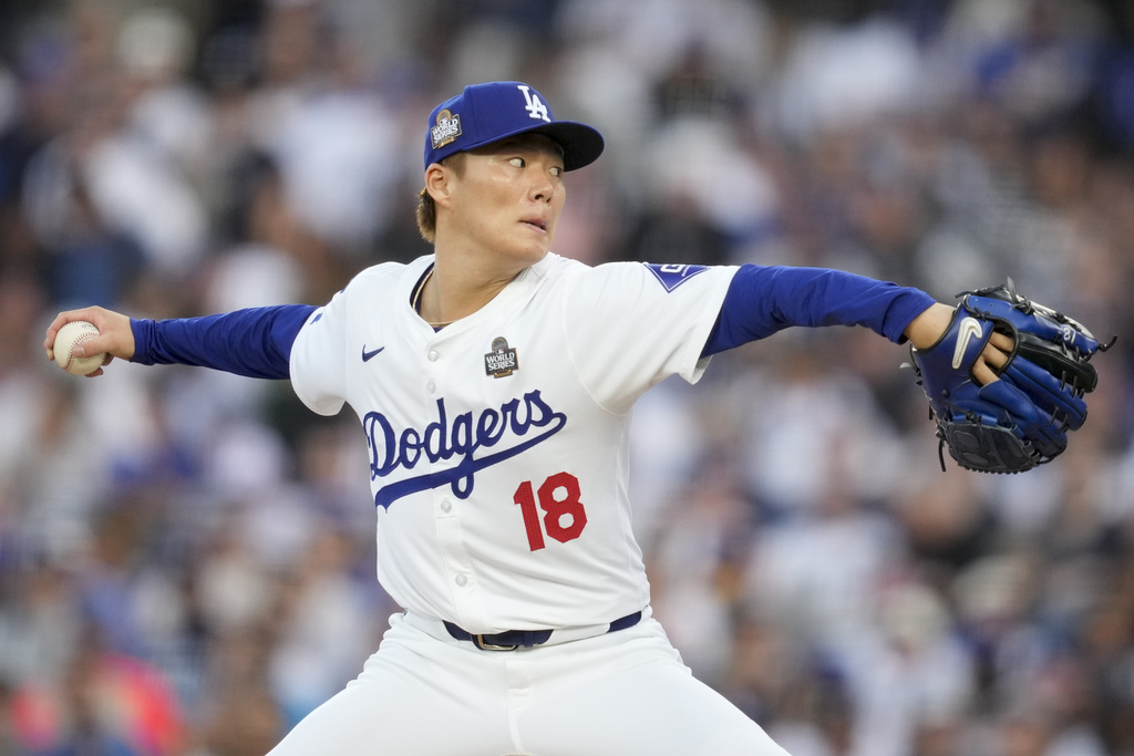 Los Angeles Dodgers pitcher Yoshinobu Yamamoto throws against the New York Yankees during the first inning in Game 2 of the baseball World Series, Saturday, Oct. 26, 2024, in Los Angeles.