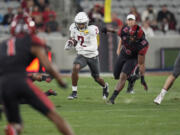 Washington State wide receiver Kyle Williams runs with the ball during the first half of an NCAA college football game against San Diego State Saturday, Oct. 26, 2024, in San Diego.