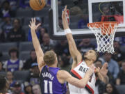 Sacramento Kings forward Domantas Sabonis (11) shoots over Portland Trail Blazers forward Toumani Camara, right, during the first half of an NBA basketball game in Sacramento, Calif., Monday, Oct. 28, 2024.