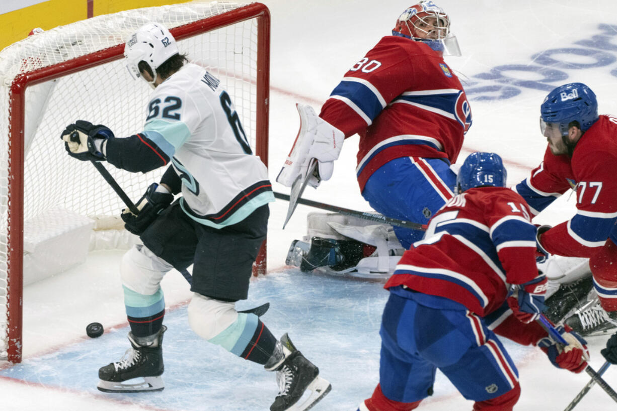 Seattle Kraken's Brandon Montour (62) scores on Montreal Canadiens goaltender Cayden Primeau (30) during the second period of an NHL hockey game in Montreal, Tuesday, Oct. 29, 2024.