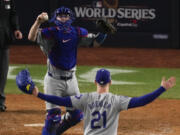 Los Angeles Dodgers pitcher Walker Buehler and catcher Will Smith celebrate their win against the New York Yankees in Game 5 to win the baseball World Series, Wednesday, Oct. 30, 2024, in New York.