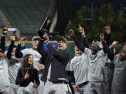 New York Yankees&#039; Giancarlo Stanton holds up the MVP trophy after Game 5 of the baseball AL Championship Series Sunday, Oct. 20, 2024, in Cleveland. The Yankees won 5-2 to advance to the World Series. (AP Photo/Godofredo A.