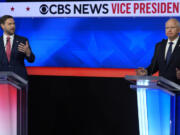 Republican vice presidential nominee Sen. JD Vance, R-Ohio, and Democratic vice presidential candidate Minnesota Gov. Tim Walz speak at the same time during a vice presidential debate hosted by CBS News, Tuesday, Oct. 1, 2024, in New York.