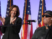 Democratic presidential nominee Vice President Kamala Harris listens as Stevie Wonder performs &ldquo;Redemption Song&rdquo; during a church service and early vote event at Divine Faith Ministries International, Sunday, Oct. 20, 2024, in Jonesboro, Ga.