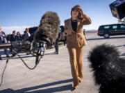 Democratic presidential nominee Vice President Kamala Harris walks toward reporters to speak before boarding Air Force Two, as she departs Las Vegas from Harry Reid International Airport, Thursday, Oct. 10, 2024, en route to Arizona.