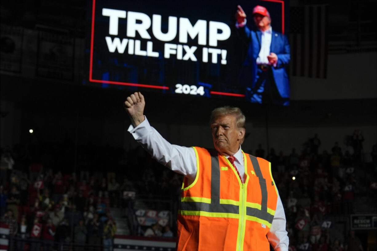 Republican presidential nominee former President Donald Trump gestures after speaking at a campaign rally at Resch Center, Wednesday, Oct. 30, 2024, in Green Bay, Wis.