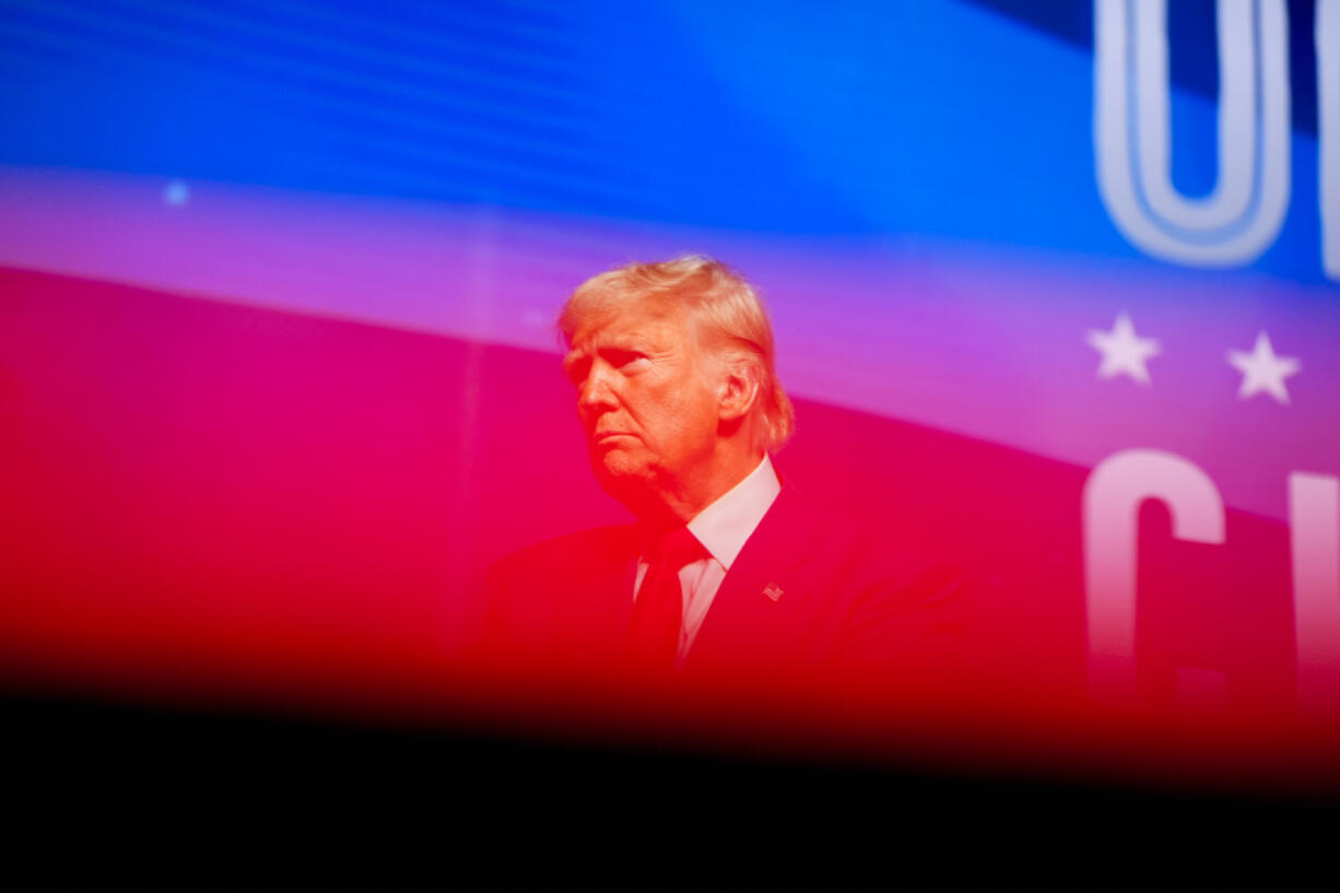 Republican presidential nominee former President Donald Trump stands on stage after speaking during a campaign rally at Thomas &amp; Mack Center, Thursday, Oct. 24, 2024, in Las Vegas.