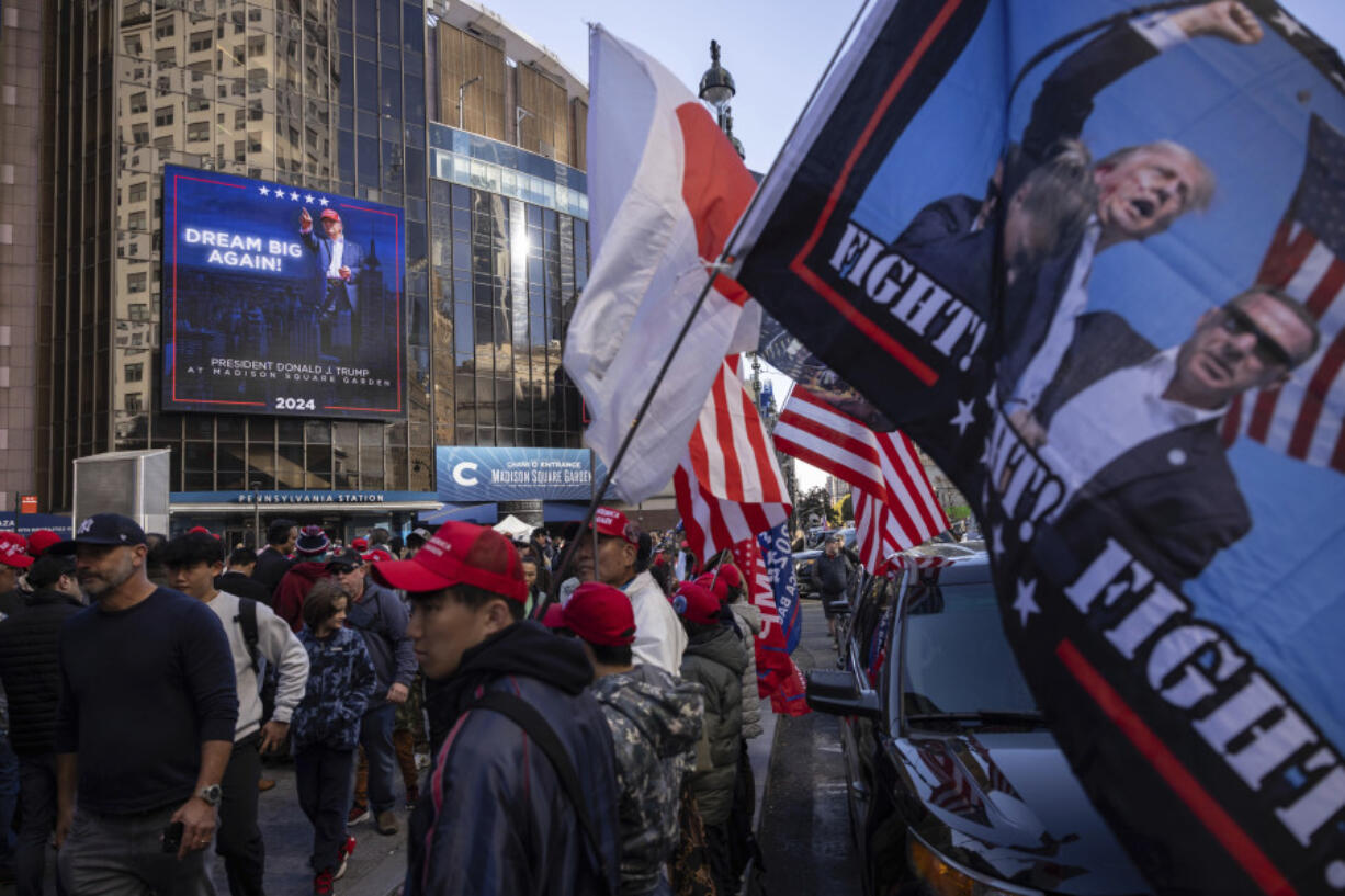 Supporters of Republican presidential nominee former President Donald Trump gather for his campaign rally outside Madison Square Garden, Sunday, Oct. 27, 2024, in New York.