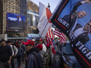 Supporters of Republican presidential nominee former President Donald Trump gather for his campaign rally outside Madison Square Garden, Sunday, Oct. 27, 2024, in New York.