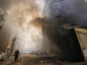 Smoke rises from the site of an Israeli airstrike in Dahiyeh, Beirut, Lebanon, Wednesday, Oct. 2, 2024.