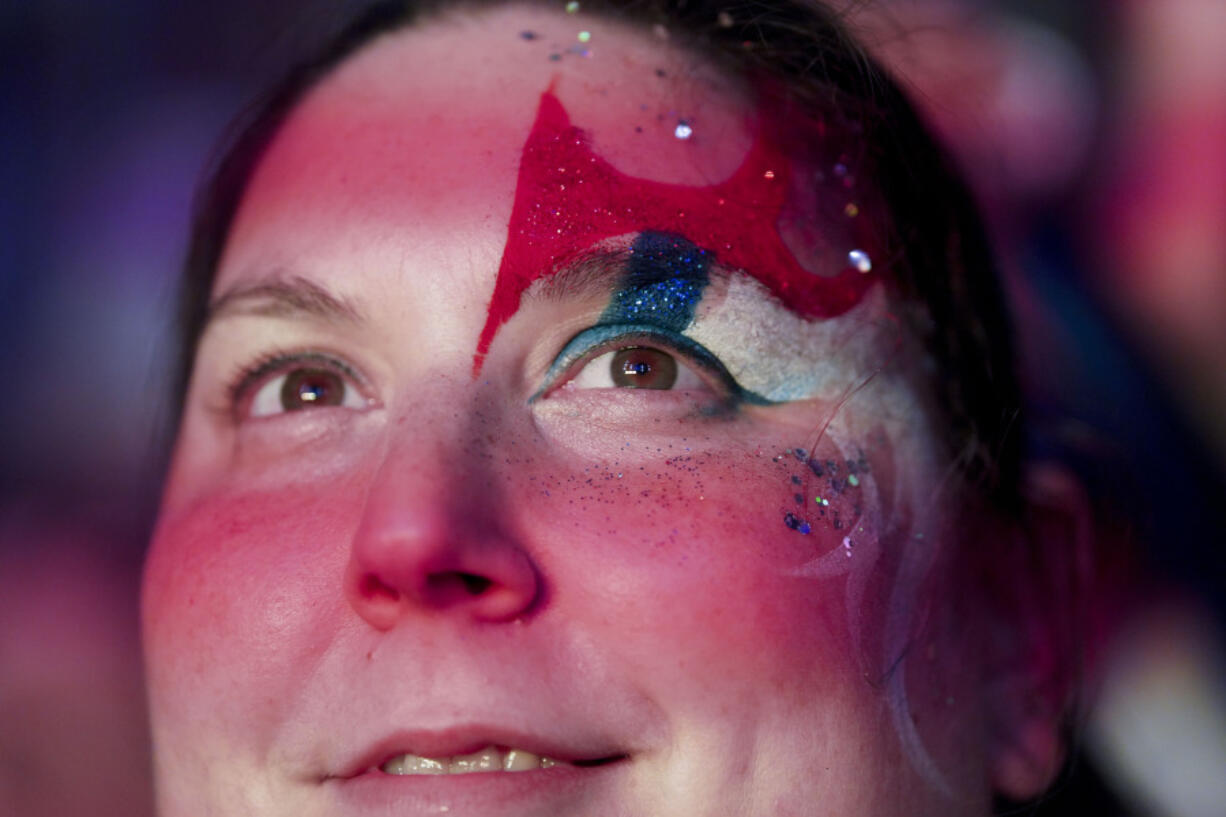 A supporter of Frente Amplio presidential candidate Yamandu Orsi attends a rally five days ahead of elections in Montevideo, Uruguay, Tuesday, Oct. 22, 2024.