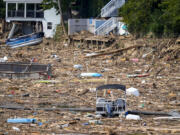 Debris is strewn on the lake in the aftermath of Hurricane Helene, Wednesday, Oct. 2, 2024, in Lake Lure, N.C.