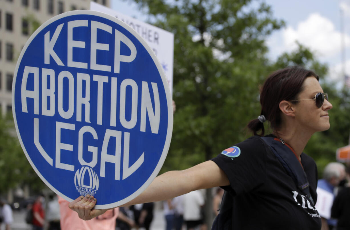 FILE - An. Abortion rights demonstrator holds a sign during a rally on May 14, 2022, in Chattanooga, Tenn.