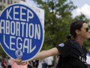 FILE - An. Abortion rights demonstrator holds a sign during a rally on May 14, 2022, in Chattanooga, Tenn.