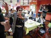 People attend a Zumba exercise class at Sunshine Adult Day Center in Bergenfield, N.J., Monday, Aug. 26, 2024.