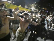 Vanderbilt fans celebrate as they carry the goalpost down West End Avenue after defeating Alabama in an NCAA football game on Saturday, Oct. 5, 2024, in Nashville, Tenn.