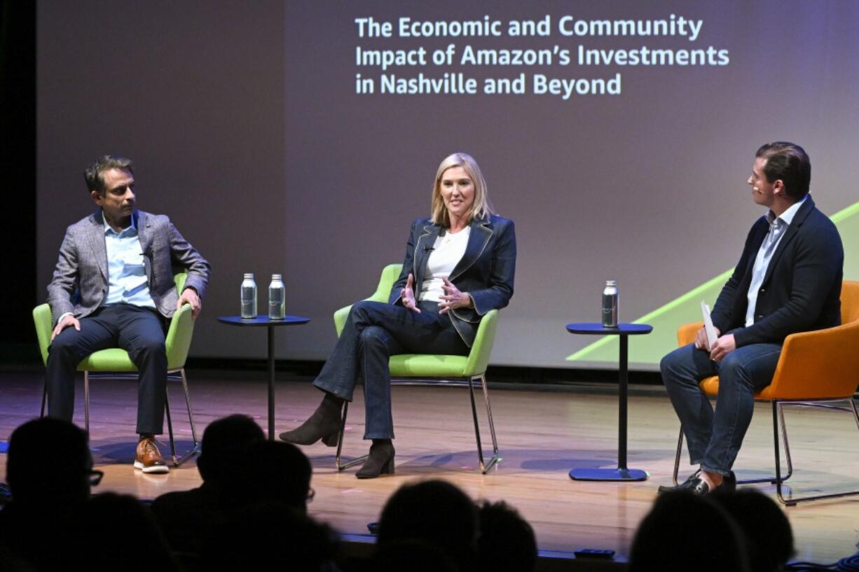 IMAGE DISTRIBUTED FOR AMAZON - Holly Sullivan, Vice President of Worldwide Economic Development at Amazon, center, and Vikram Pathania, Principal Economist at Amazon, left, participate in a moderated conversation at Delivering the Future at the National Museum of African American Music on Tuesday, Oct. 8, 2024 in Nashville.