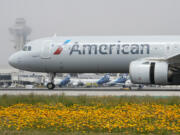 FILE - An American Airlines jet taxis at the Los Angeles International Airport in Los Angeles on April 12, 2024.