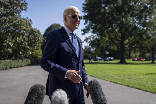 President Joe Biden speaks to the media before boarding Marine One on the South Lawn of the White House in Washington, Saturday, Oct. 5, 2024.