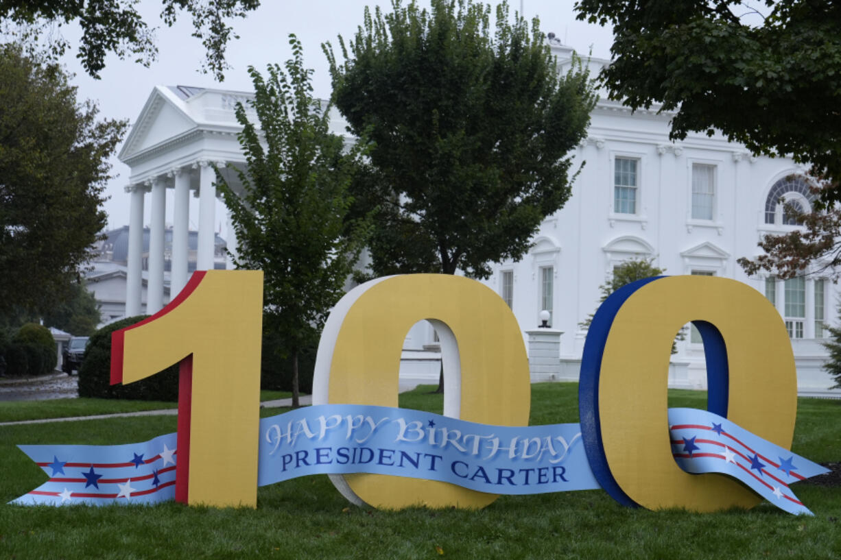 A sign wishing former President Jimmy Carter a happy 100th birthday sits on the North Lawn of the White House in Washington, Tuesday, Oct. 1, 2024.