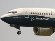 FILE - A Boeing 737 Max jet prepares to land at Boeing Field following a test flight in Seattle, Sept. 30, 2020. Two U.S. senators have asked the Department of Justice to take tougher action against Boeing executives by holding them criminally accountable for safety issues that have impacted its airplanes, Thursday, Oct. 3, 2024.