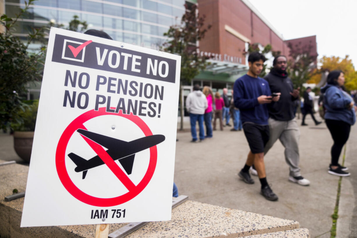 A picket sign sits outside the Angel of the Winds Arena as striking Boeing employees gather to cast their votes Wednesday in Everett.