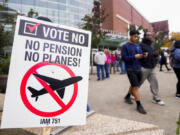 A picket sign sits outside the Angel of the Winds Arena as striking Boeing employees gather to cast their votes Wednesday in Everett.