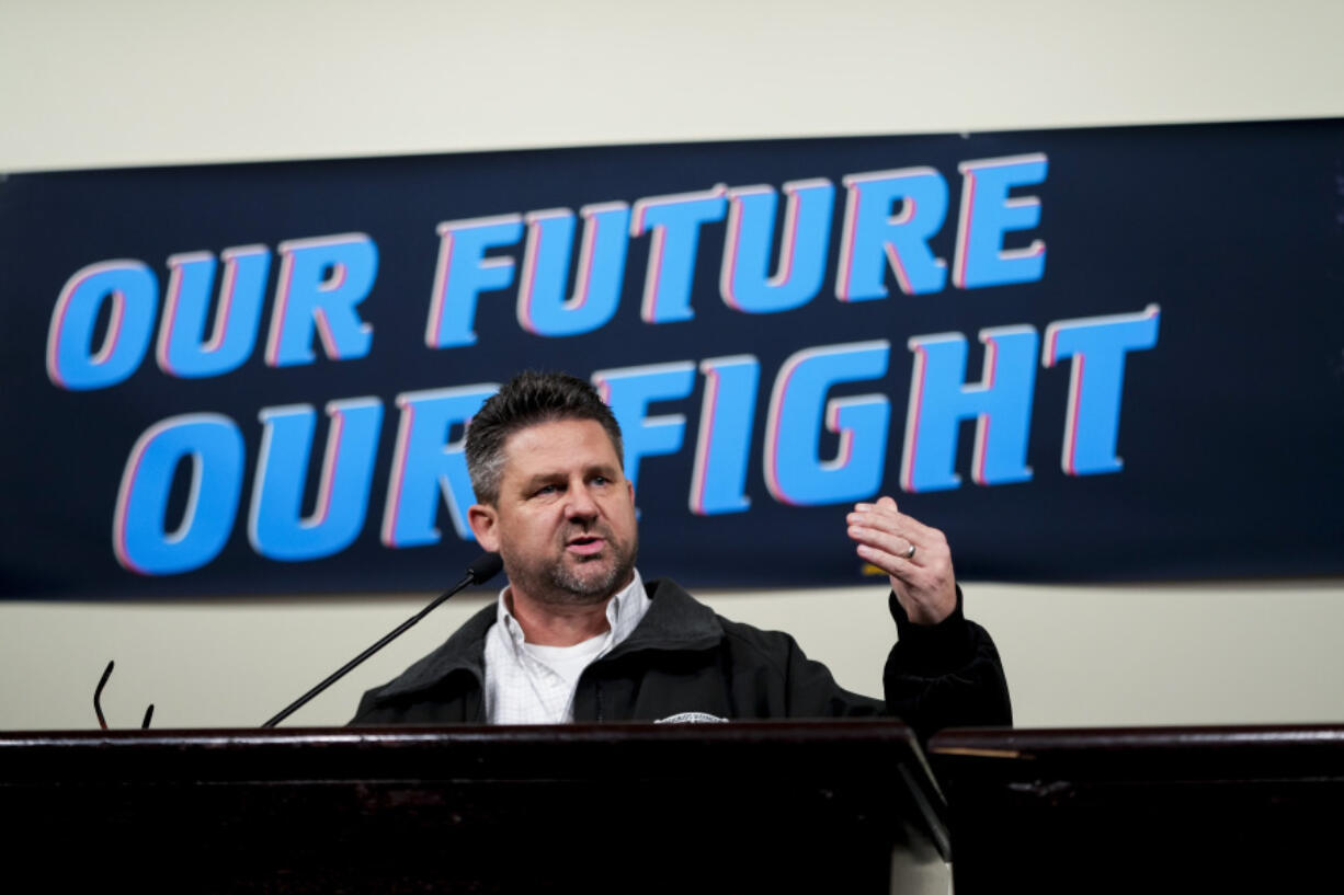 IAM District 751 president Jon Holden speaks to union members while announcing that they voted to reject a new contract offer from Boeing, Wednesday, Oct. 23, 2024, at Seattle Union Hall in Seattle.