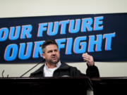 IAM District 751 president Jon Holden speaks to union members while announcing that they voted to reject a new contract offer from Boeing, Wednesday, Oct. 23, 2024, at Seattle Union Hall in Seattle.