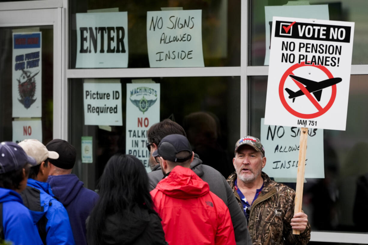 Bartley Stokes Sr., who has worked for Boeing for 46 years, encourages other employees on strike to vote no on a new contract offer from the company Wednesday, Oct. 23, 2024, at a voting location in the Angel of the Winds Arena in Everett, Wash.