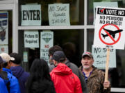 Bartley Stokes Sr., who has worked for Boeing for 46 years, encourages other employees on strike to vote no on a new contract offer from the company Wednesday, Oct. 23, 2024, at a voting location in the Angel of the Winds Arena in Everett, Wash.