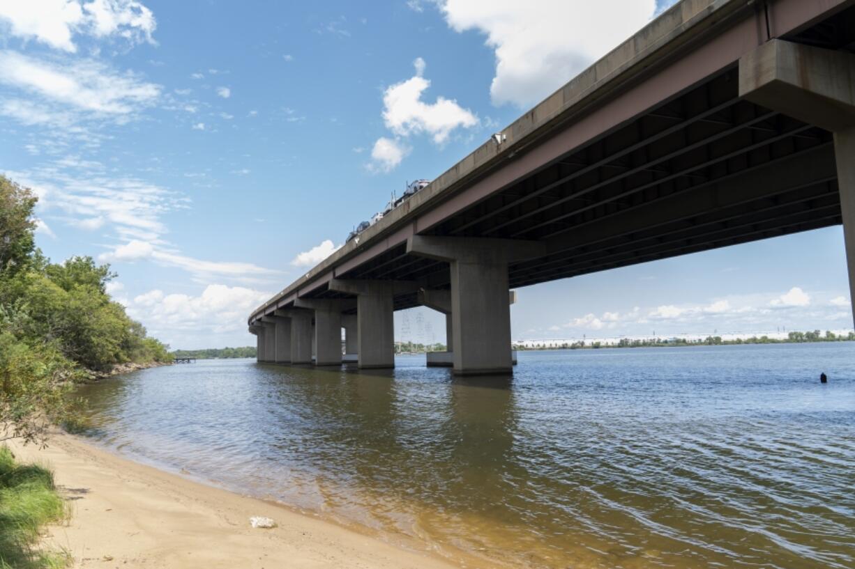 A small beach below the remaining portion of the Francis Scott Key Bridge is seen, Tuesday, Aug. 13, 2024, in Turner Station, Md. The water is unsafe for swimming and fishing from decades of industrial pollution.