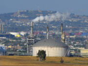 FILE - The Phillips 66 refinery is shown, July 16, 2014 in the Wilmington area of Los Angeles. (AP Photo/Mark J.