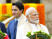 FILE - Canada&rsquo;s Prime Minister Justin Trudeau, left, walks past India&rsquo;s Prime Minister Narendra Modi as they take part in a wreath-laying ceremony at Raj Ghat, Mahatma Gandhi&rsquo;s cremation site, during the G20 Summit in New Delhi, Sept. 10, 2023.