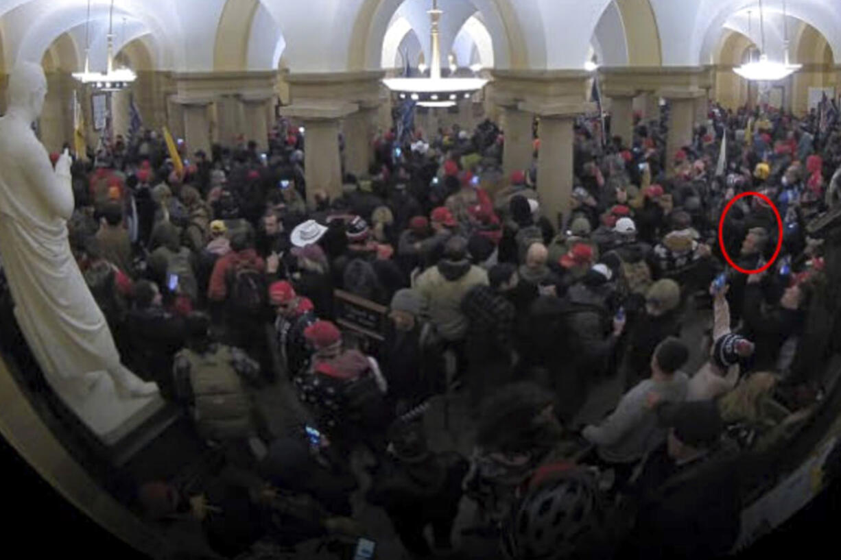 This image from security video of Michael Daniele, a retired New Jersey State Police trooper, seen in the Crypt in the U.S. Capitol on Jan. 6, 2021, was contained in the Justice Department affidavit and complaint in support of the arrest of Daniele.