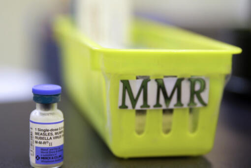 FILE - A vial of a measles, mumps and rubella vaccine sits on a countertop at a pediatrics clinic in Greenbrae, Calif., on Feb. 6, 2015.