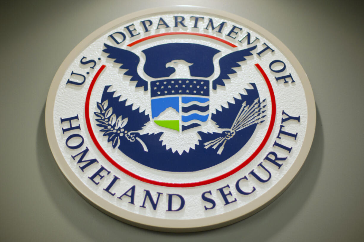 FILE - The Department of Homeland Security logo is seen during a news conference in Washington, Feb. 25, 2015.