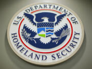 FILE - The Department of Homeland Security logo is seen during a news conference in Washington, Feb. 25, 2015.