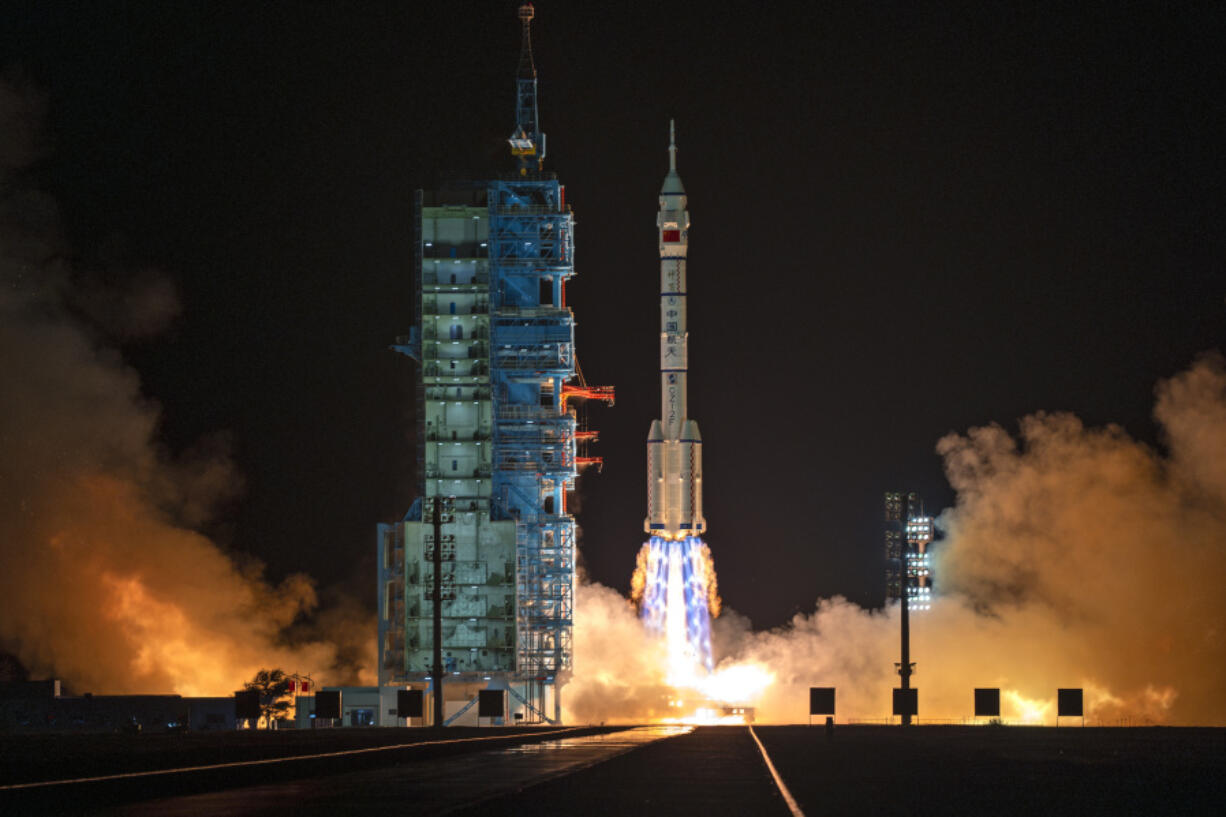 A Long March rocket with a Shenzhou-19 spacecraft atop takes off from the Jiuquan Satellite Launch Center in Jiuquan, northwestern China in the early hours of Wednesday, Oct. 30, 2024.